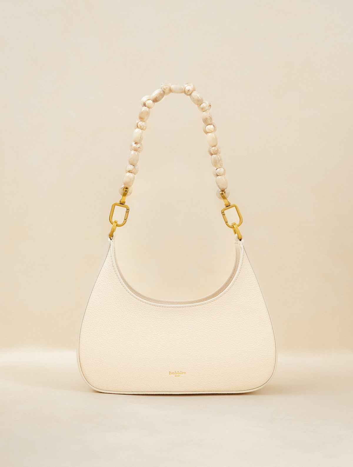 Bobbies Aléria Seafoam handbag — product view on warm studio background
