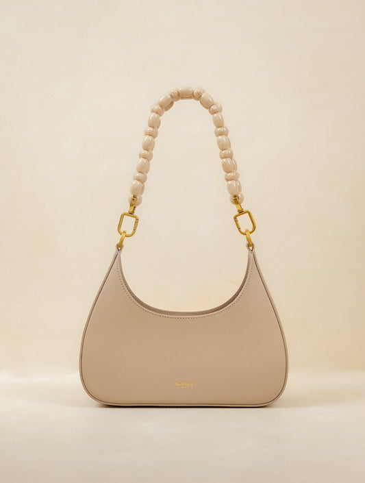 Bobbies Aléria Latte handbag — product view on warm studio background