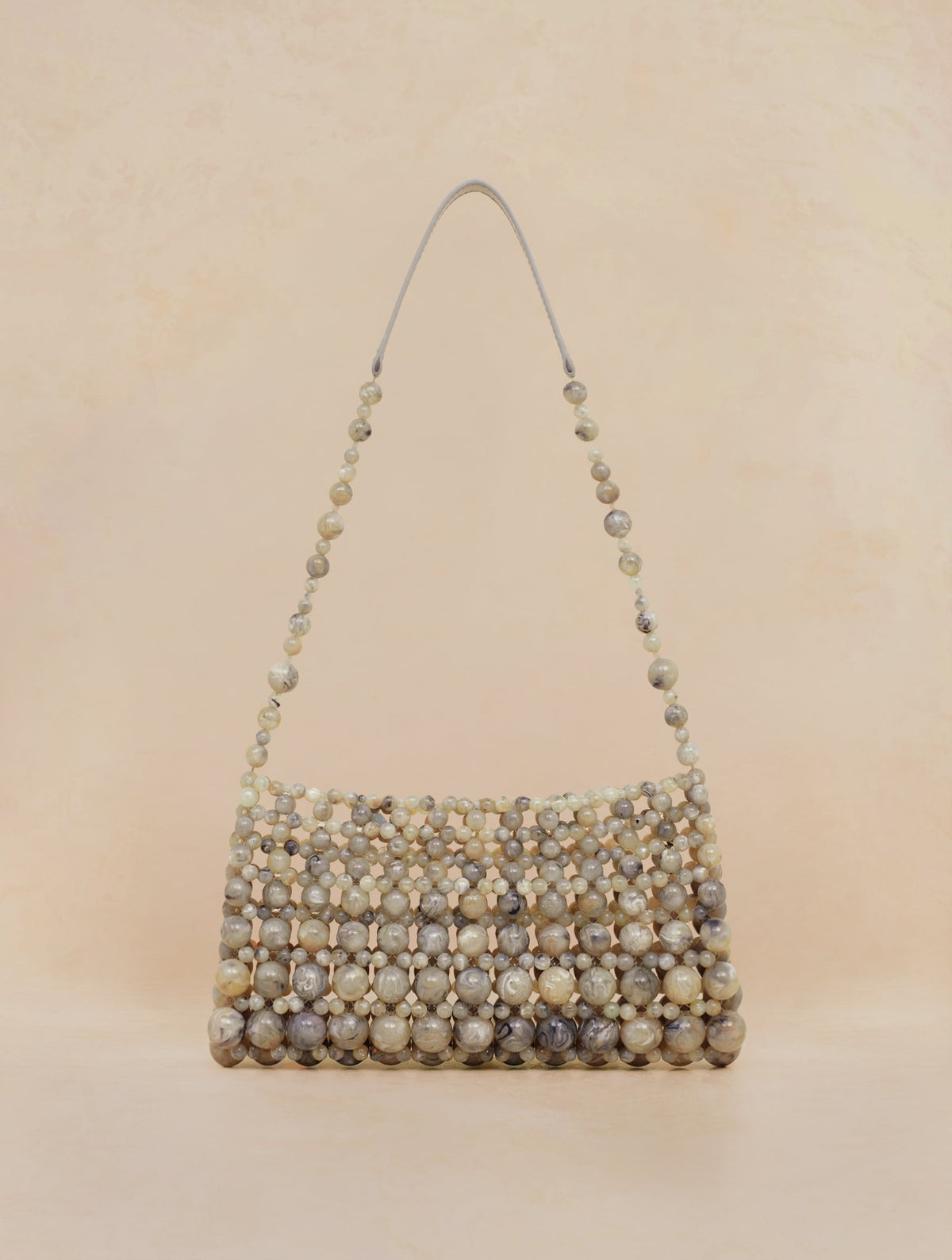Bobbies Deià Cipollino handbag — product view on warm studio background