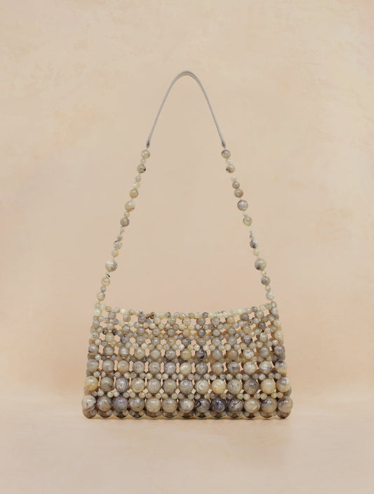 Bobbies Deià Cipollino handbag — product view on warm studio background