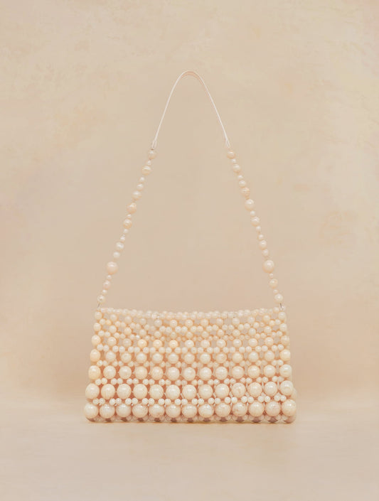 Bobbies Deià Ivory handbag — product view on warm studio background