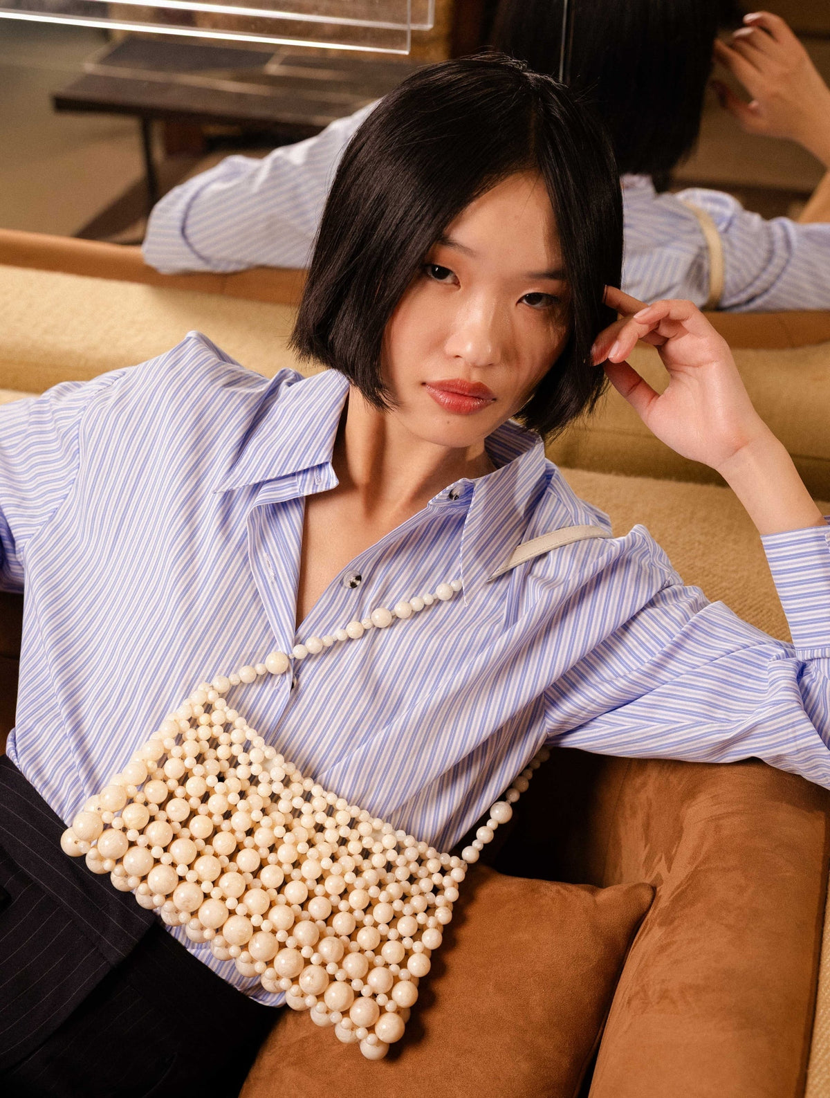 Bobbies Deià Ivory handbag — editorial view